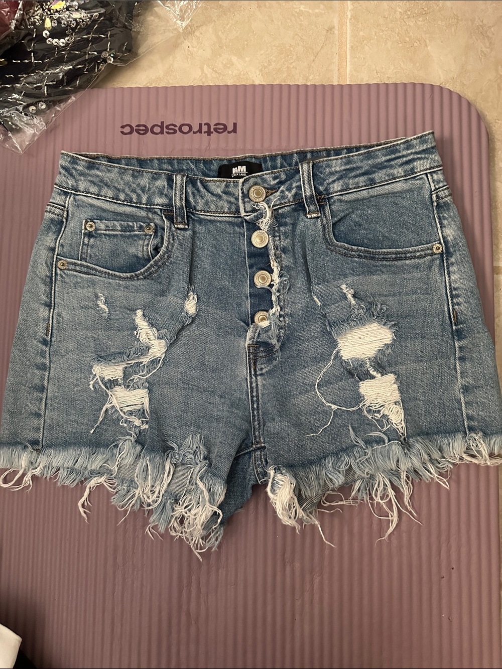Distressed High-Rise Blue Denim Shorts with Frayed Hem